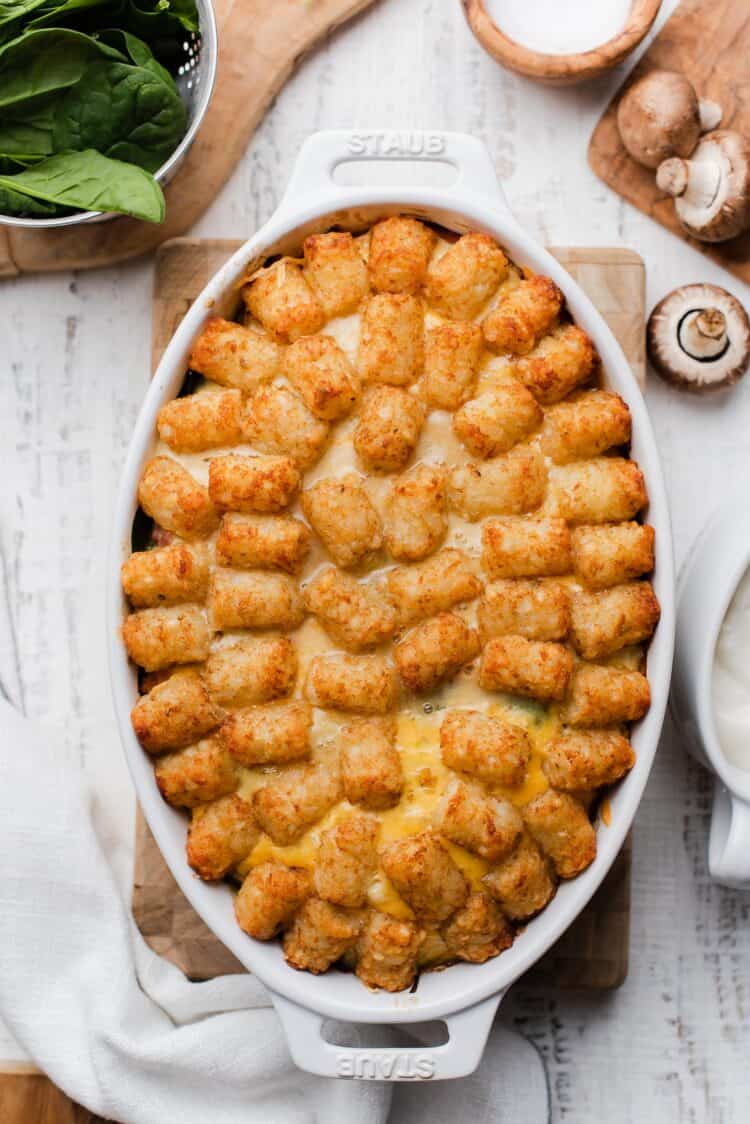 Tater Tot Breakfast Casserole in a white oval baking dish.