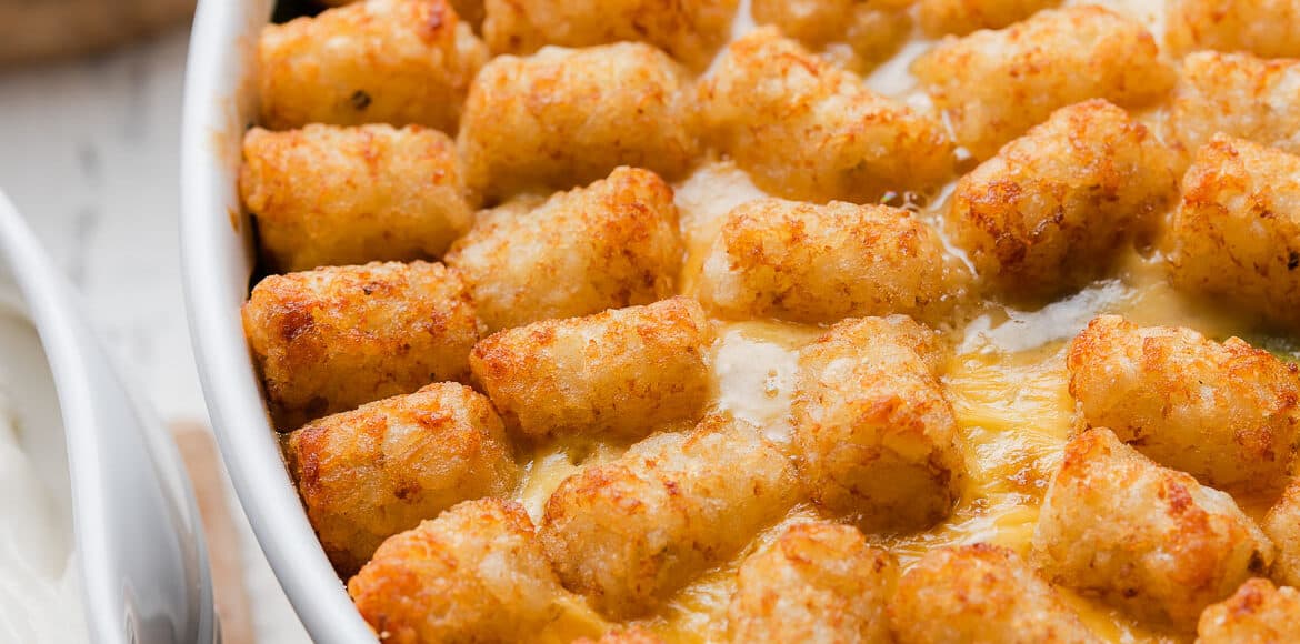 Tater Tot Breakfast Casserole in a white oval baking dish.