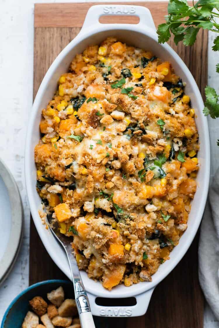 Winter Squash and Quinoa Bake in a white oval baking dish.