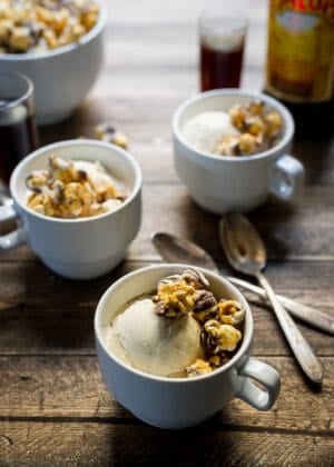 Three mugs filled with ice cream, espresso, and caramel popcorn for Caramel Corn Kahlúa Affogatos.