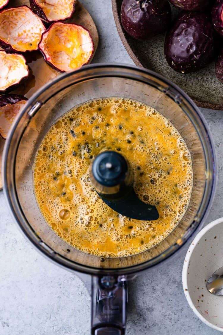 Extracting passion fruit juice in a food processor.