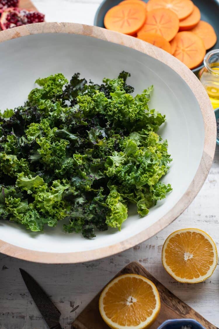 Kale for Kale Persimmon Salad in a salad bowl