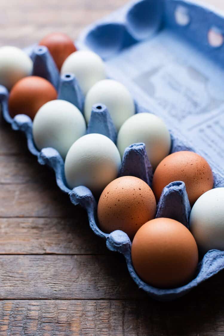 Fresh eggs in a blue egg carton