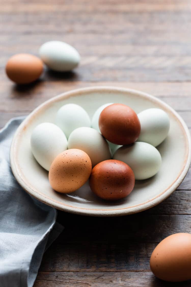 Farm eggs in a cream bowl.