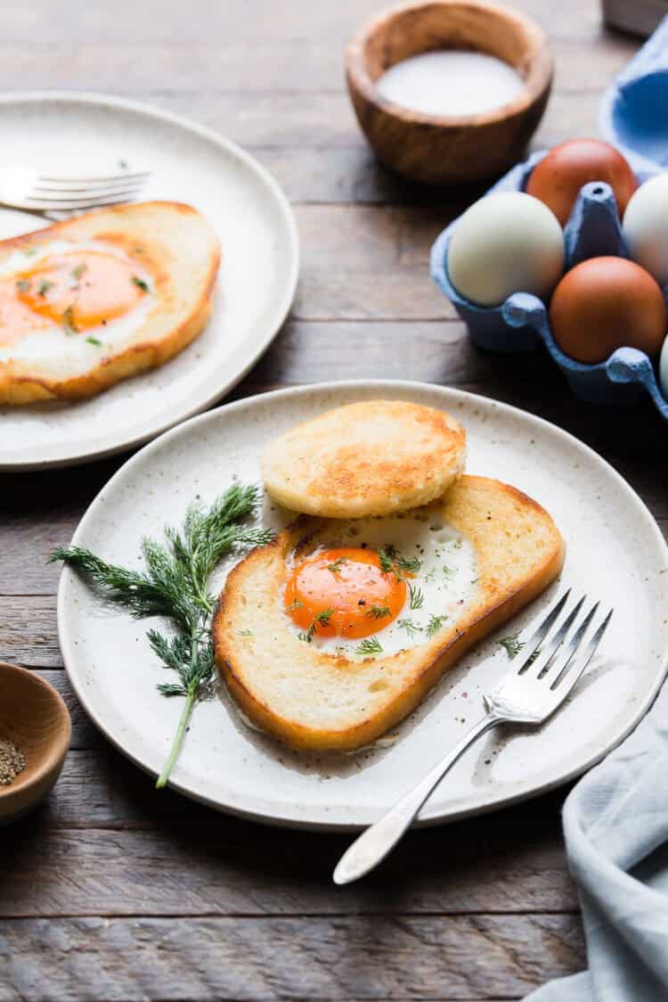 Eggs in a Nest on a plate garnished with dill.