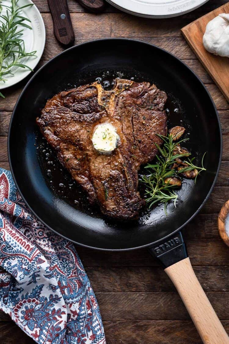 Angus Beef Steak Recipe with Garlic Herb Compound Butter in a cast iron pan by Staub