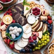 Simple Dessert Charcuterie Board with fruit, cookies, cake, cheesecake, candied apples, and more!
