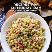 A bowl of colorful pasta salad with the words, "20 Simple Recipes for Memorial Day & a Season of Grilling."