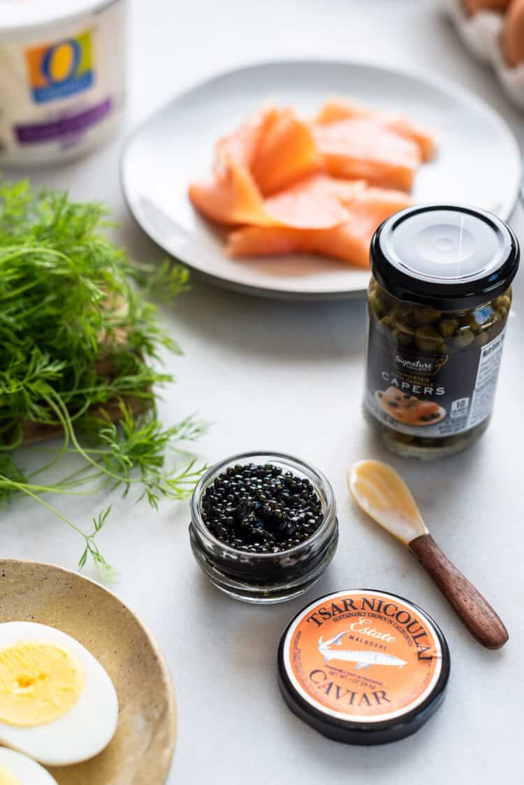 Ingredients to make a caviar and blini board.