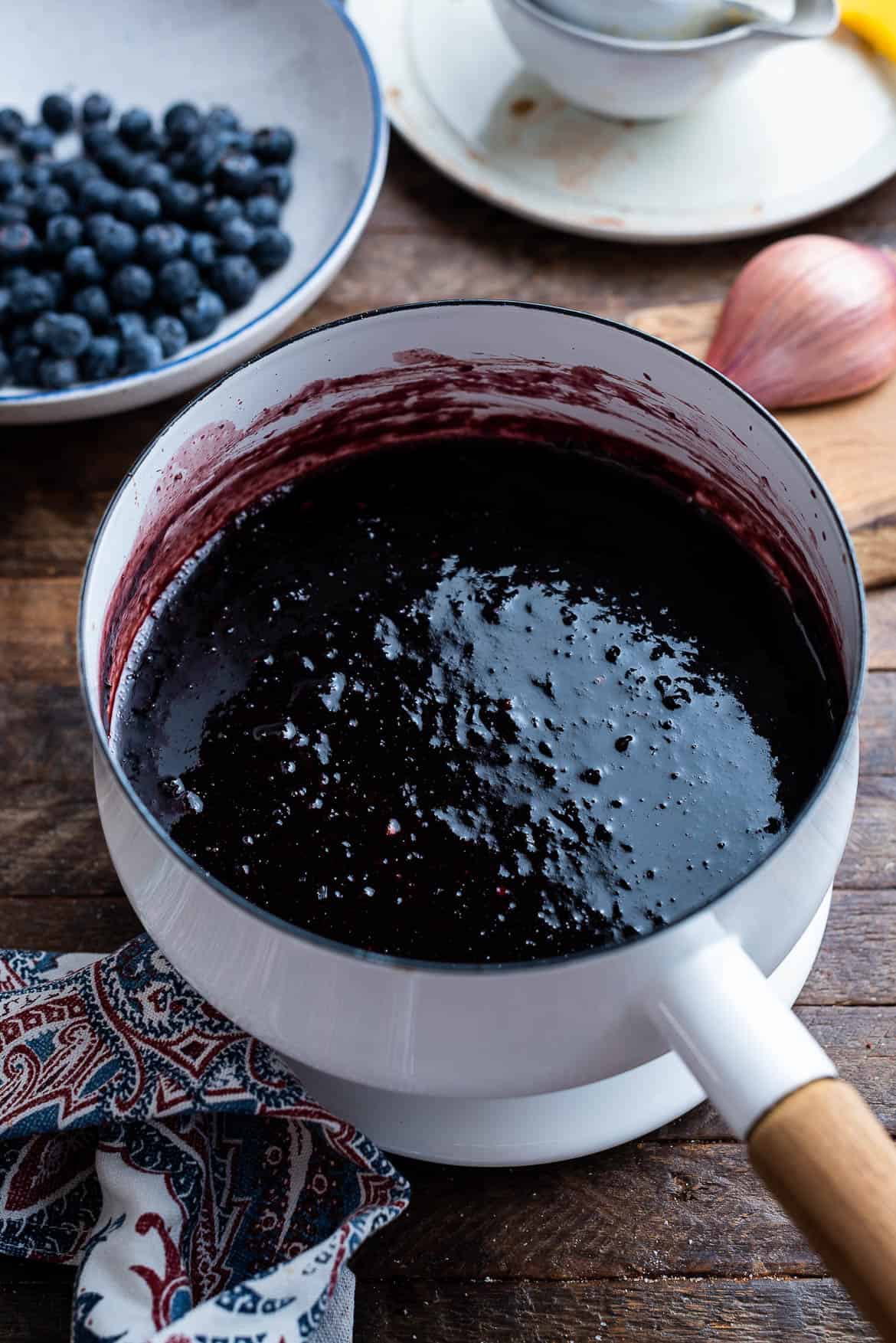 Blueberry Balsamic Barbecue Sauce in a white sauce pan.
