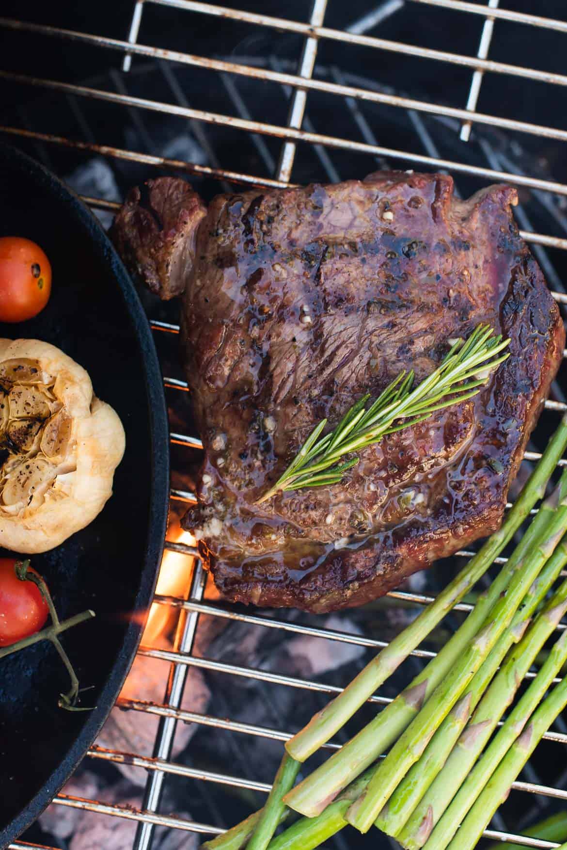 Dry aged rib eye steaks on the grill.