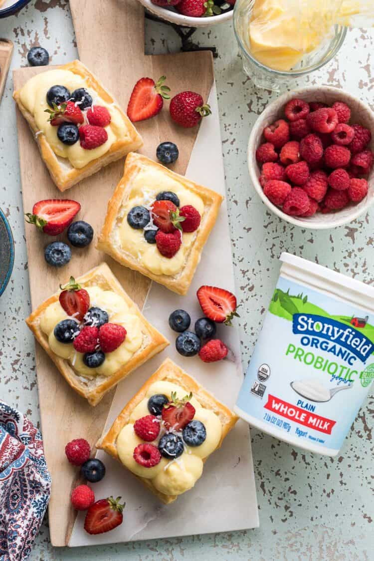 Puff Pastry Fruit Tarts filled coconut yogurt pastry cream and fresh berries with Stonyfield Organic.