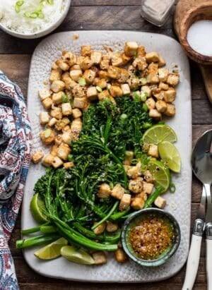 Firecracker Tofu With Broccolini and Chili Garlic Oil on a platter.