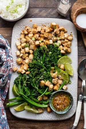 Firecracker Tofu With Broccolini and Chili Garlic Oil on a platter.