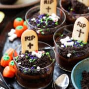Halloween Dirt Cups with Avocado Chocolate Pudding decorated with tombstone cookies.