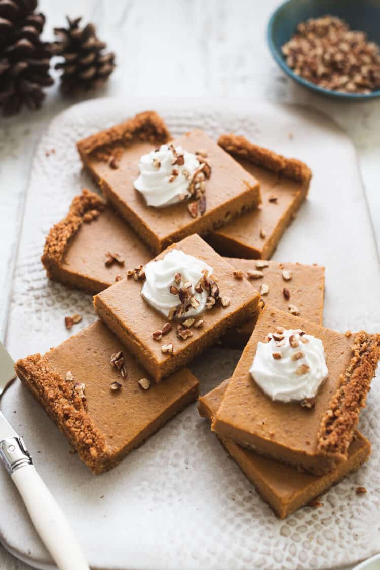 Pumpkin Pie Bars with Graham Cracker Crust with whipped cream.