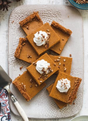 Pumpkin Pie Bars with Graham Cracker Crust on a serving tray.