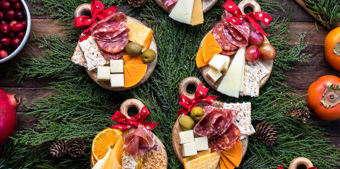 Individual Mini Holiday Charcuterie Boards that looks like Christmas ornaments on at tree.