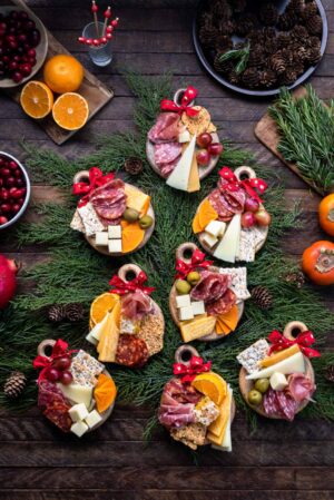 Individual Mini Holiday Charcuterie Boards that looks like Christmas ornaments on at tree.