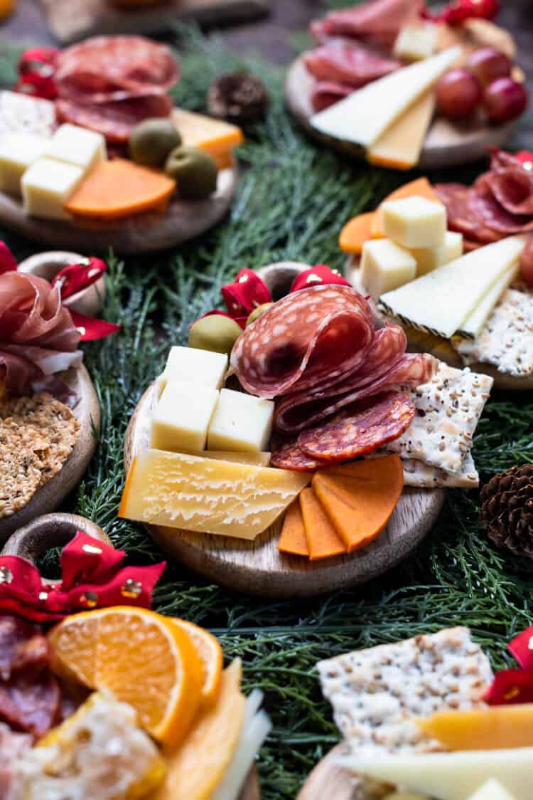 Individual Christmas Charcuterie Boards on mini cheese boards.
