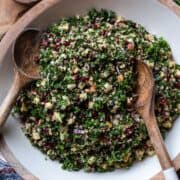 Kale Tabbouleh with Apples, Almonds, and Pomegranate in a salad bowl.