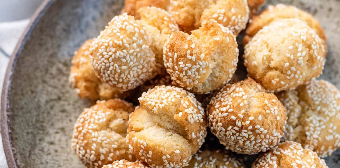 Laughing Doughnuts (Sesame Smiling Cookie Balls) stacked in a bowl.