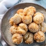 Laughing Doughnuts (Sesame Smiling Cookie Balls) stacked in a bowl.