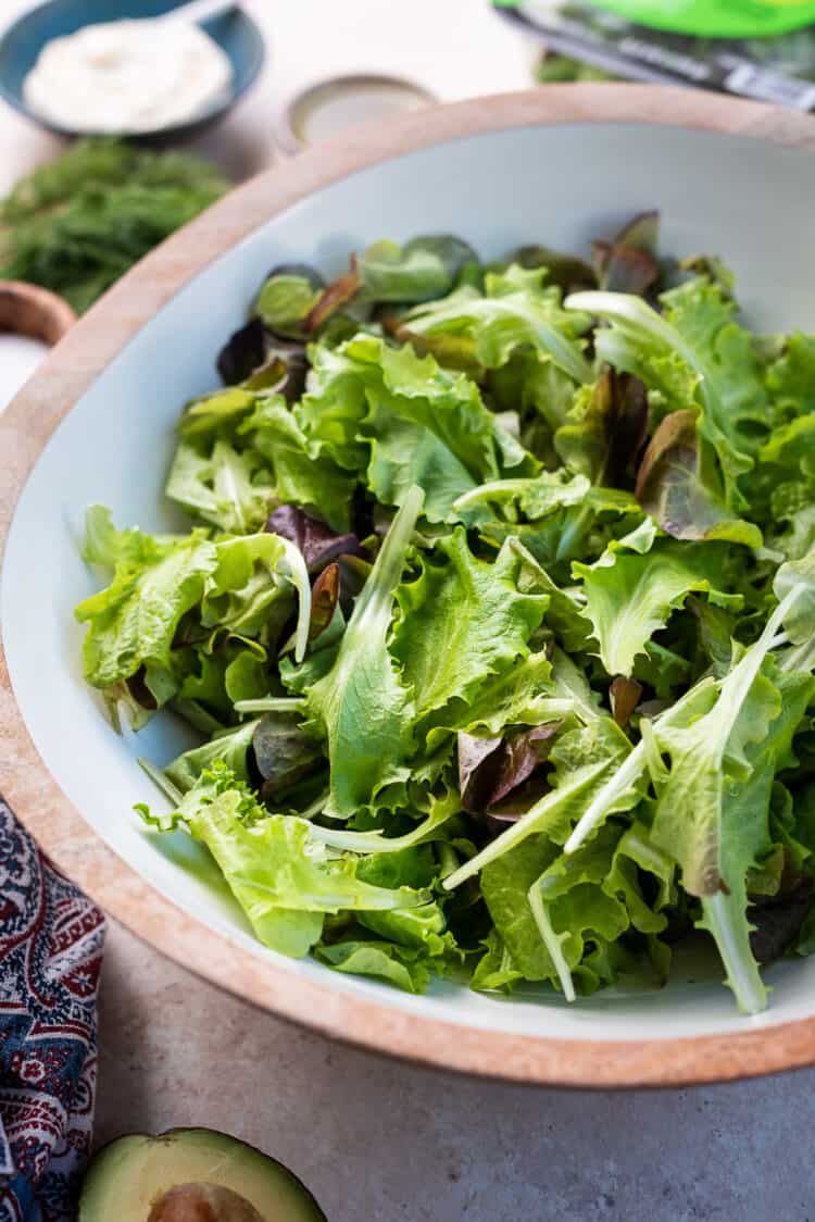 Fresh green lettuce in a large salad bowl.