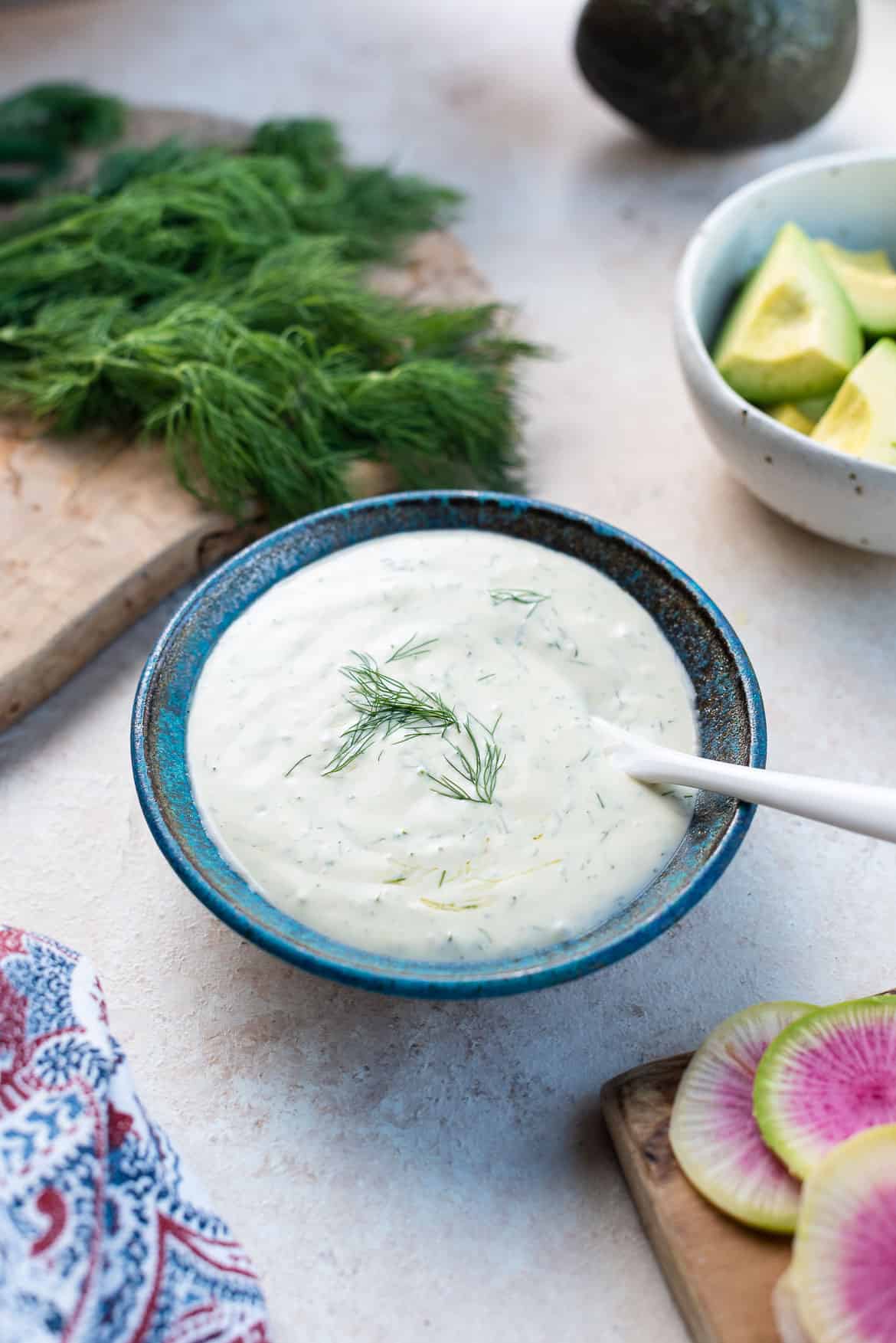 Homemade mayonnaise dressing with dill in a bowl.
