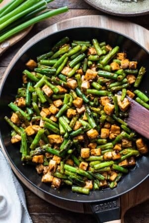 Stir-fried String Beans With Tofu in Black Bean Sauce in a saute pan.