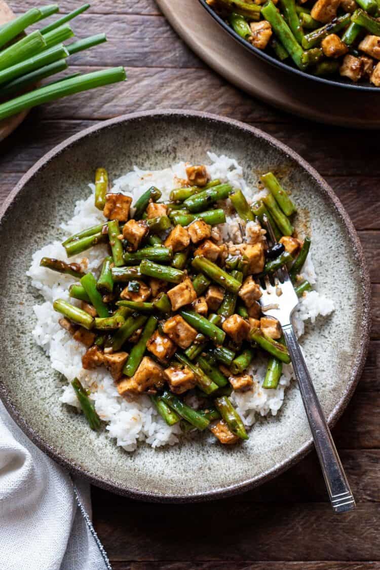 Stir-fried String Beans With Tofu in Black Bean Sauce served over rice.