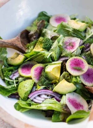Lettuce Salad with Mayonnaise Dressing, watermelon radishes, avocados, red onion, and dill.