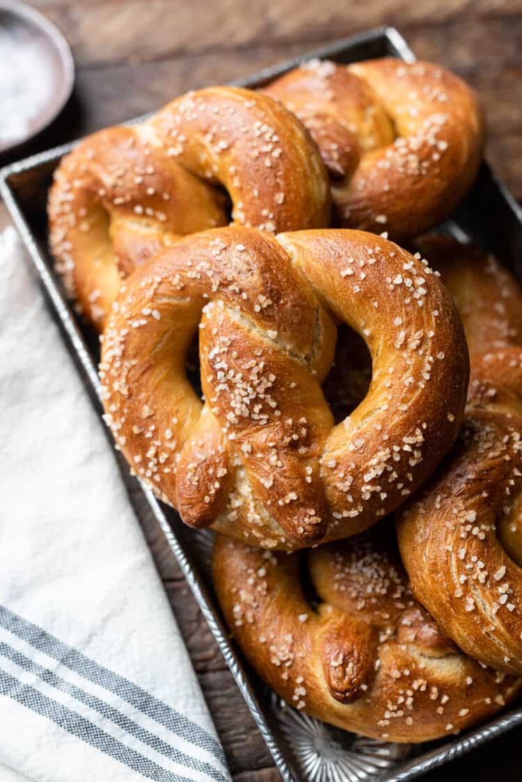 Bavarian Pretzels stacked in a baking pan.