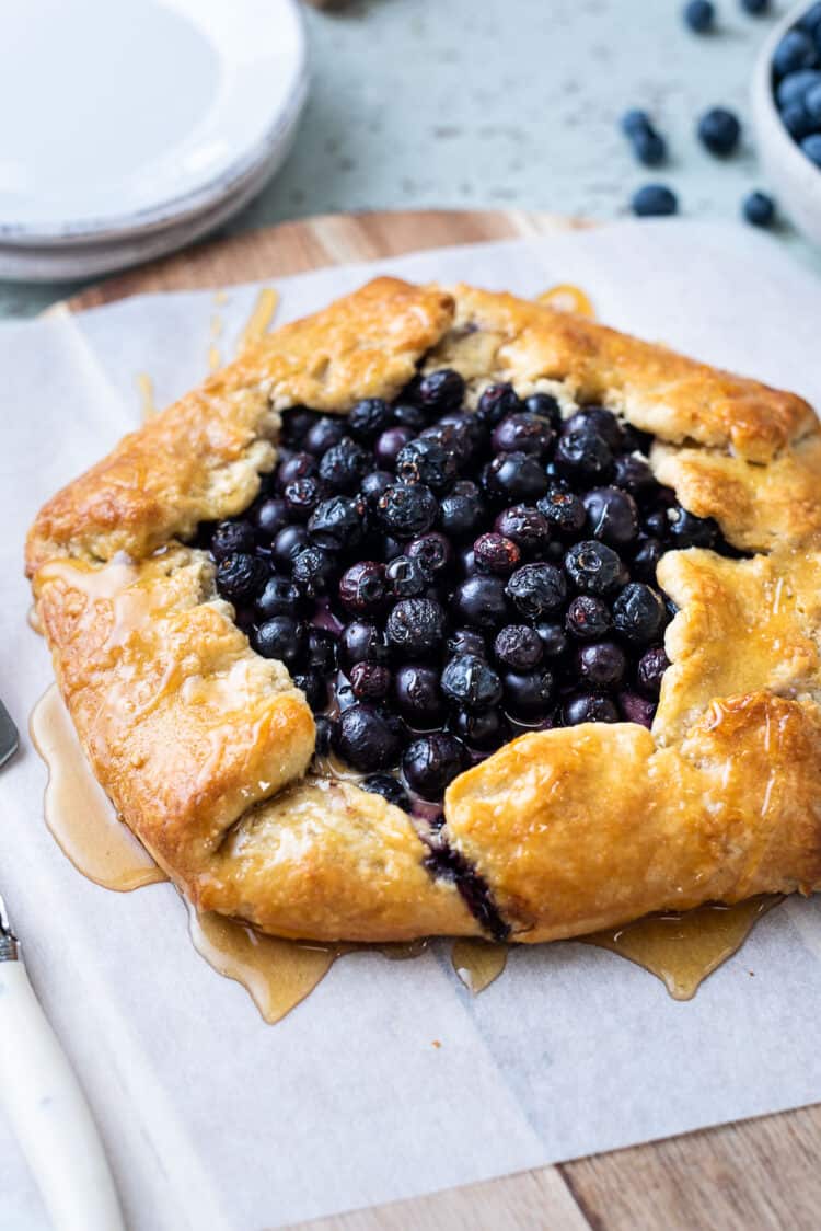 Blueberry and Greek Yogurt Breakfast Galette drizzled with honey.