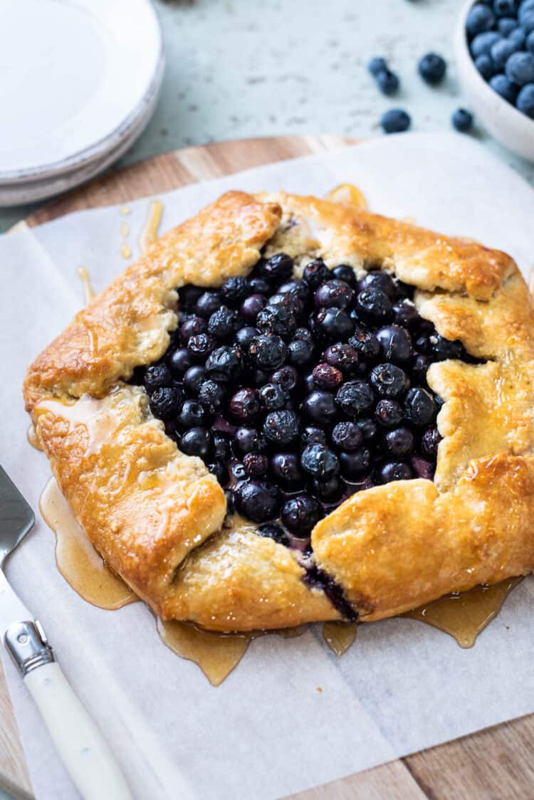 Blueberry and Greek Yogurt Breakfast Galette drizzled with honey.