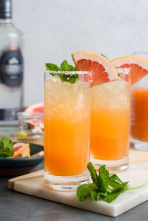 Ginger Beer Paloma in a glass garnished with grapefruit.