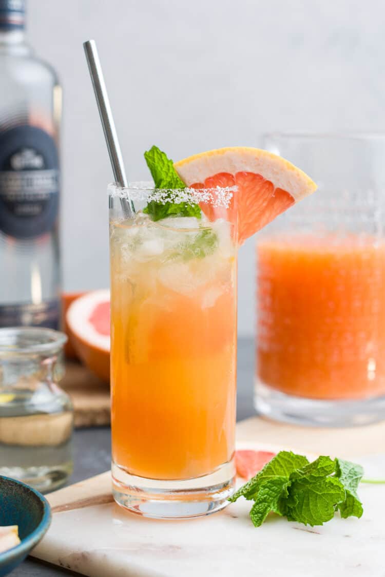 Ginger Beer Paloma in a salted-rim glass garnished with grapefruit.