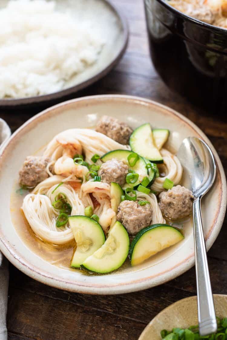 Filipino Meatball Noodle Soup, also known as misua soup with bola bola, in a bowl.