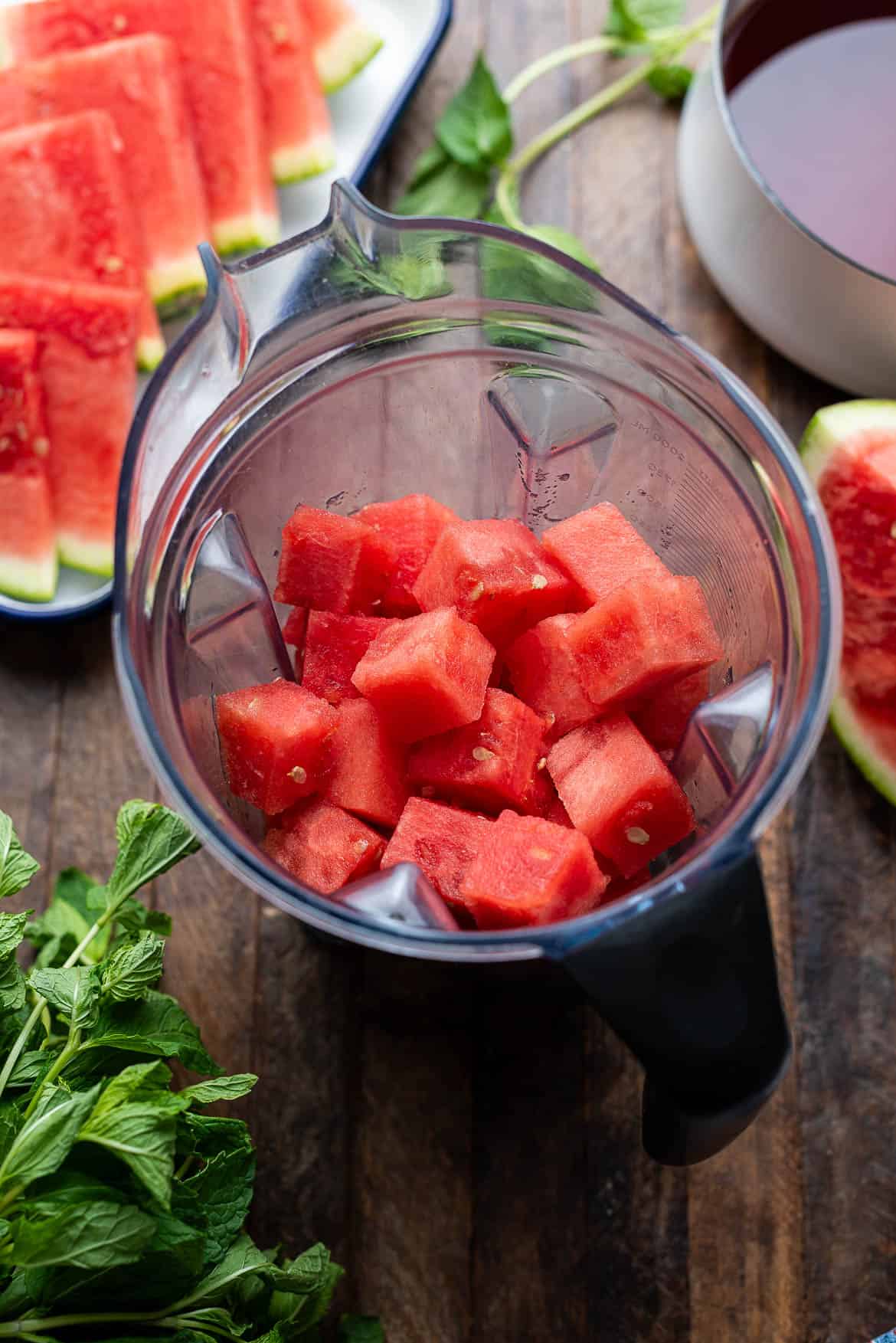 Chunks of watermelon in a blender.