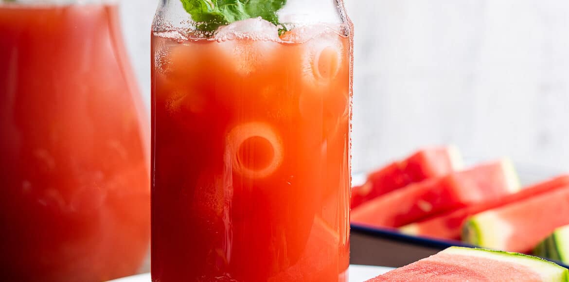 Watermelon Sweet Tea in a glass garnished with mint.
