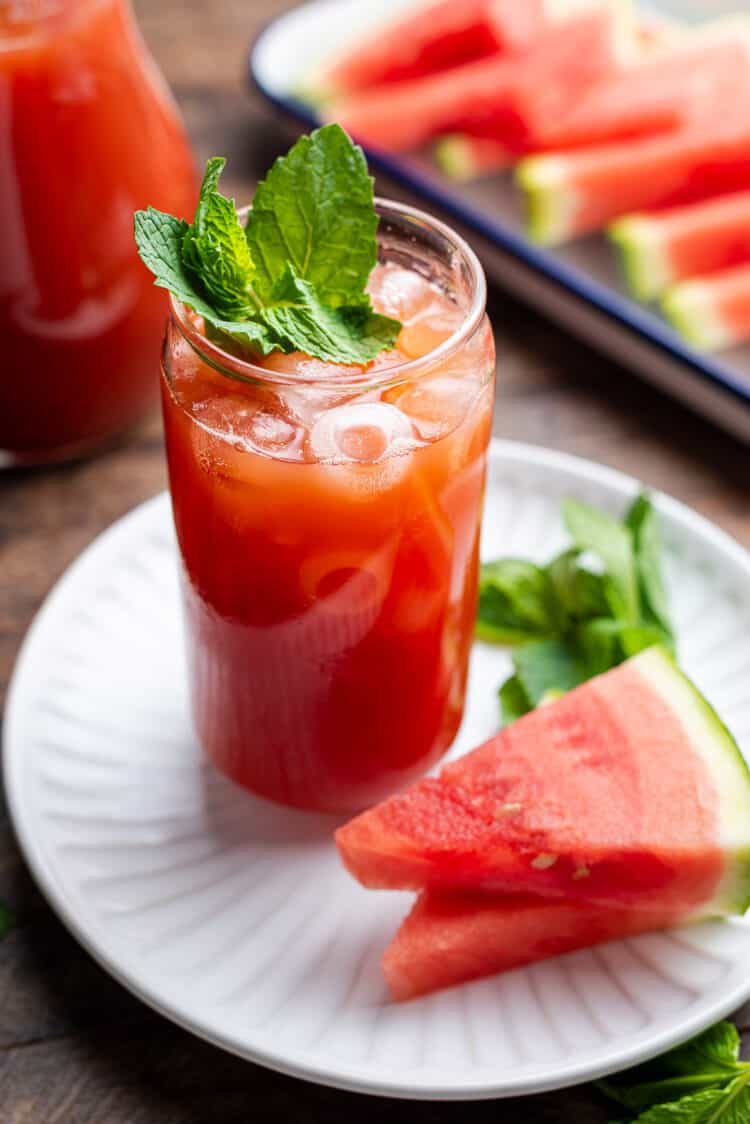 Watermelon Sweet Tea in a glass garnished with fresh mint.