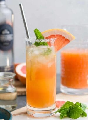 Ginger Beer Paloma in a glass garnished with grapefruit.