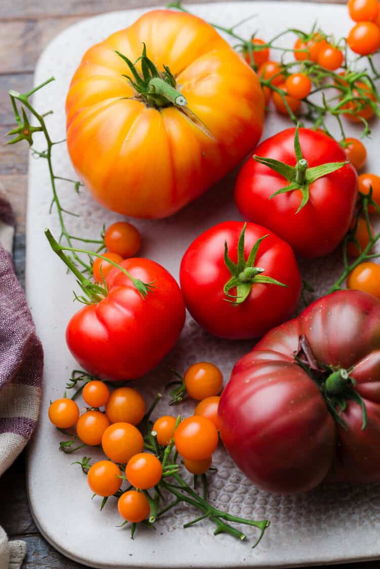 A platter full of heirloom tomatoes.