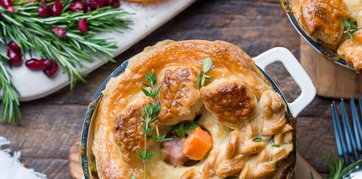 Ham Pot Pie topped with puff pastry crust in an individual-sized mini Dutch oven.
