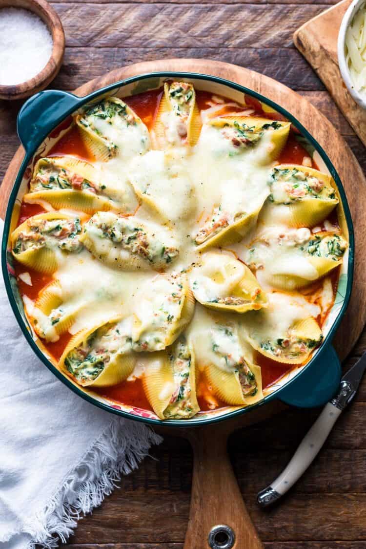 Prosciutto and Spinach Stuffed Shells in a baking dish.