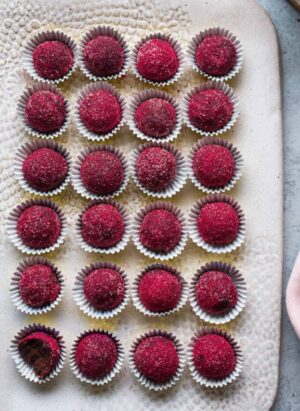 Chocolate Raspberry Truffles on a tray.