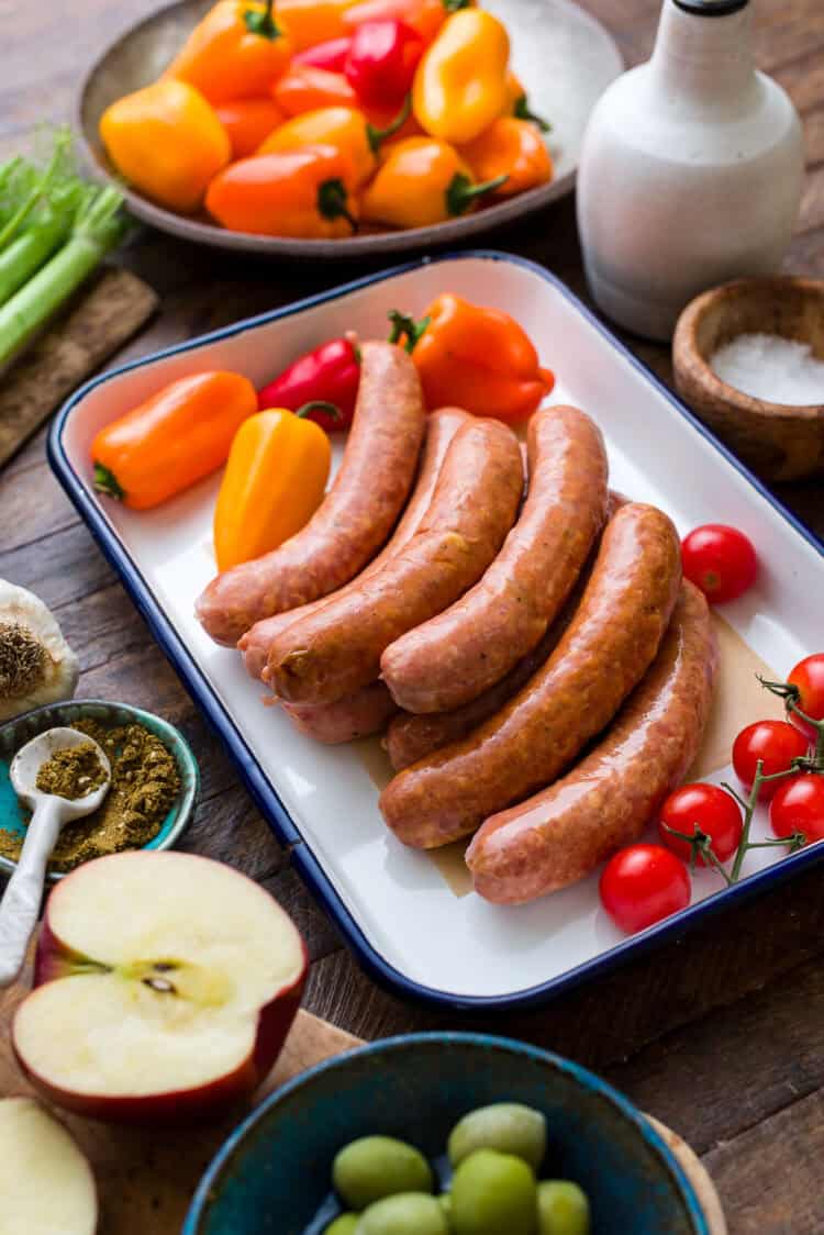 Chicken sausages in a pan for a sheet pan sausage recipe.