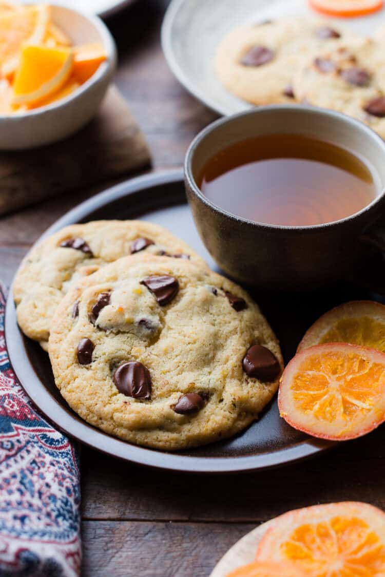 Large Dark Chocolate Orange Cookies on a brown plate.
