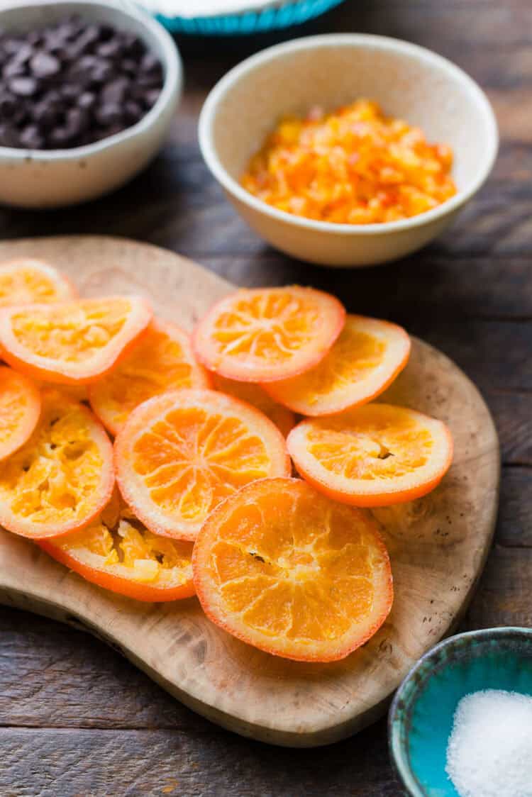 Dried orange slices on a cutting board.