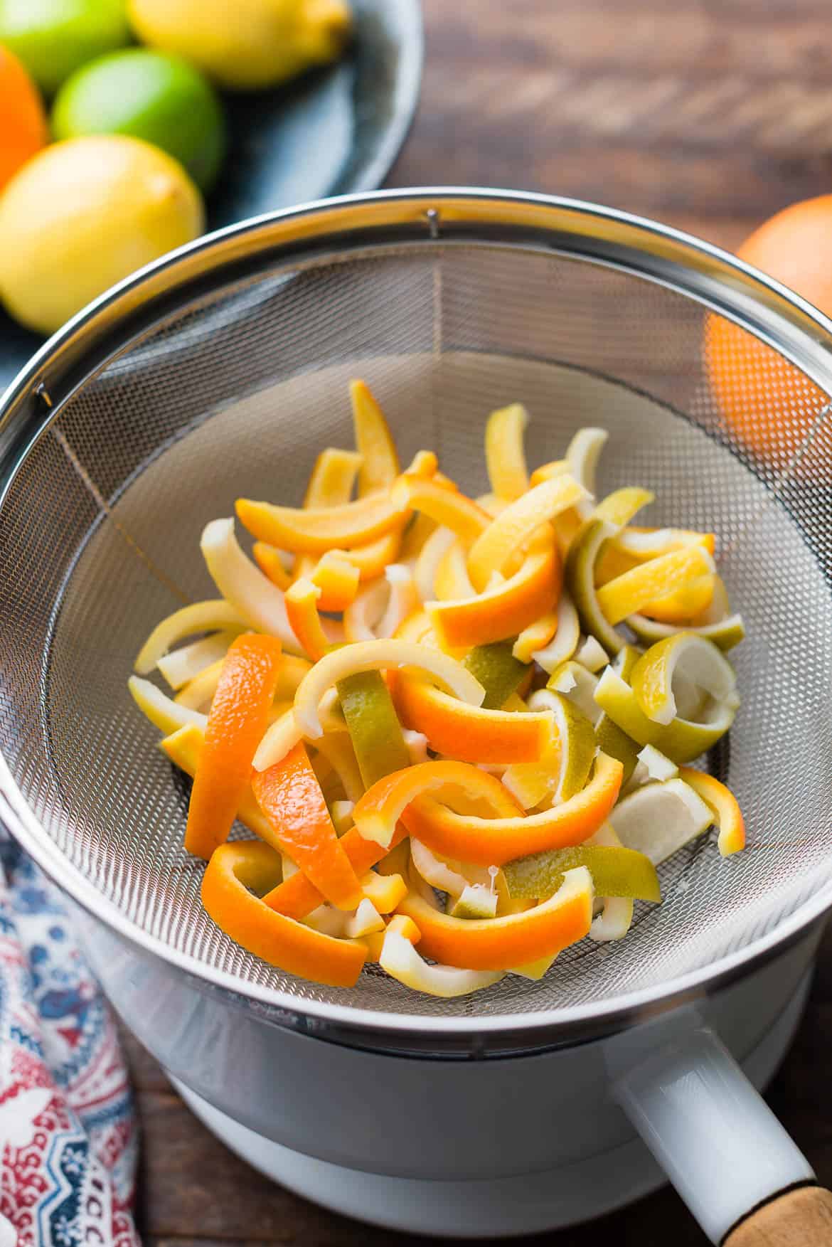 Draining peels in a colander.